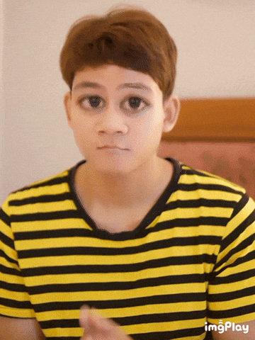 a person wearing a yellow and black striped shirt with imgplay at the bottom of the image