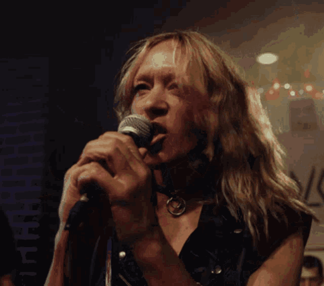 Chloe Sevigny Metal Head Singing In A Band GIF - Chloe Sevigny Metal Head Singing In A Band Poker Face Tv Show GIFs