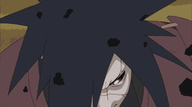 a man with a bandana that says ' naruto ' on it is being attacked by a monster