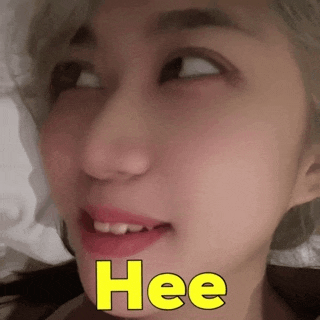 a close up of a woman 's face with the words hee written on it .