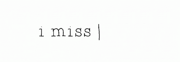 a black and white photo of the words `` i miss you ''