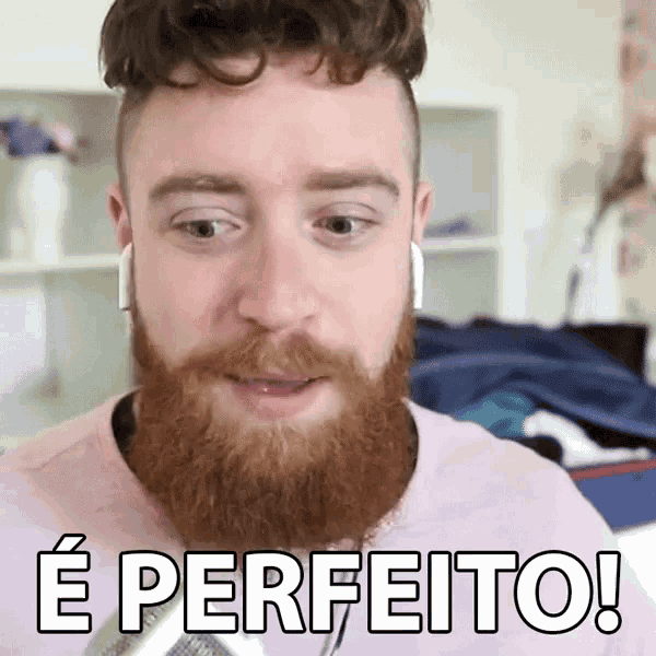 a man with a beard is wearing headphones and says e perfeito