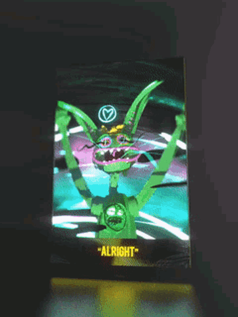 a screen with a cartoon character and the words " alright " at the bottom