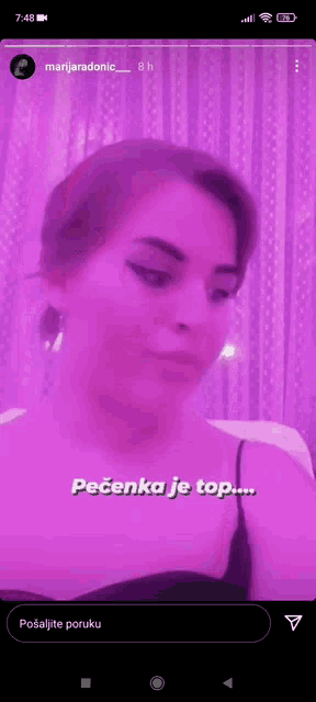 a woman 's face is shown in a purple light with the words pecenka je top