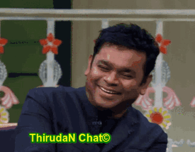 a man in a suit is smiling with the words thirdan chat below him