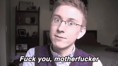 a young man wearing glasses and a purple vest is standing in a bedroom and says `` fuck you motherfucker '' .