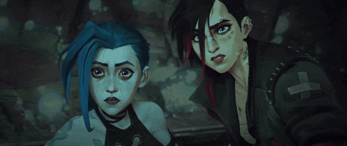 a girl with blue hair stands next to another girl with black hair
