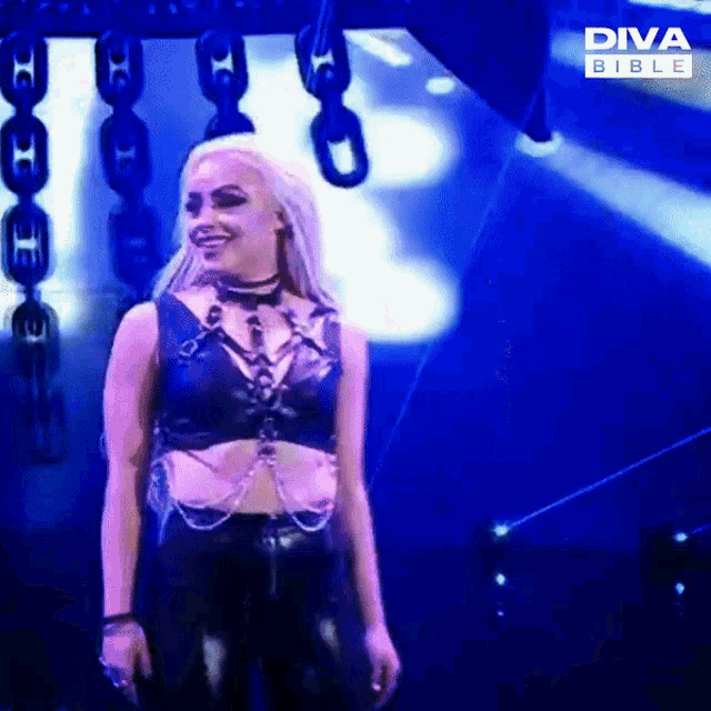 a woman stands in front of a diva bible screen