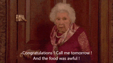 an elderly woman is standing in front of a door with the words congratulations call me tomorrow and the food was awful