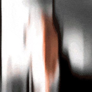 a blurry picture of a person 's face with a red glow