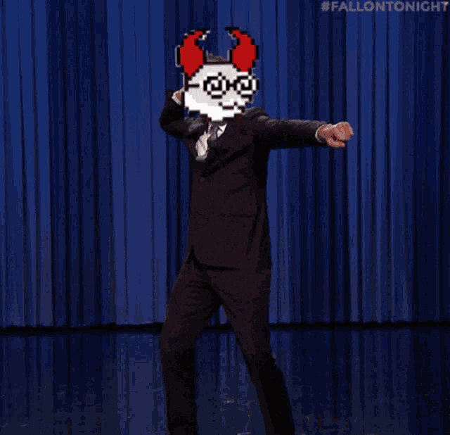 a man in a suit and tie dancing with a pixelated face on his face