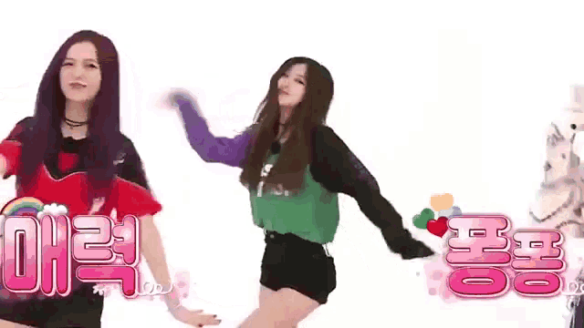 a group of girls are dancing in front of a white background with chinese writing on it