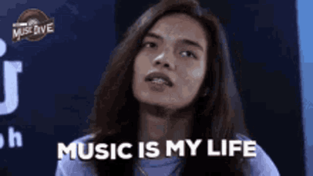 a woman is saying music is my life .