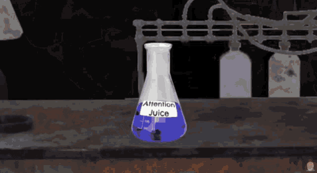 a beaker of attention juice sits on a counter