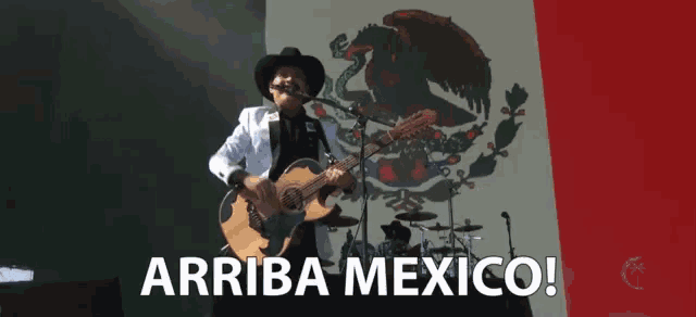 a man playing a guitar in front of a mexican flag with the words " arriba mexico " on the bottom