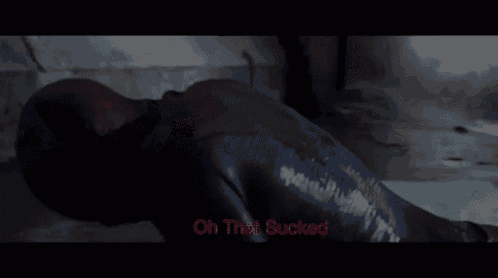 a man in a spiderman costume is laying on the floor with the words oh that sucked below him