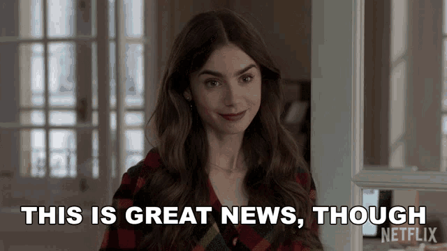 a woman is standing in front of a door and says " this is great news though "