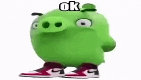 a green angry birds pig is wearing a hat and sneakers .