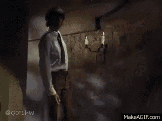 a man is kneeling down in front of a set of stairs on makeagif.com
