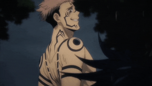 a man with a tattoo on his shoulder is smiling