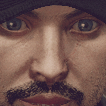 a close up of a man 's face with a beard and blue eyes