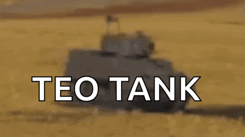 a blurred image of a tank with the words teo tank below it