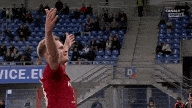 a man in a red jersey with the number 1 on it