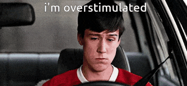 a man driving a car with the words i 'm overstimulated written above him