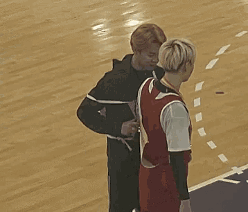 a basketball player wearing a red jersey with the number 7 on it