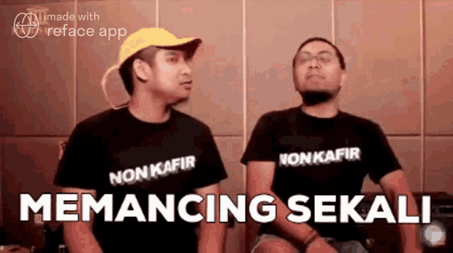 two men are sitting next to each other wearing t-shirts that say non kafir .