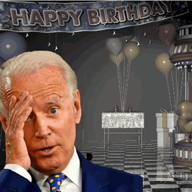 a man covering his face with his hand in front of a happy birthday banner