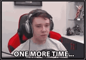 a man wearing headphones is sitting in a chair and saying `` one more time ... '' .
