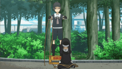 a cartoon drawing of a boy standing next to a girl tied to a box with chinese writing on it