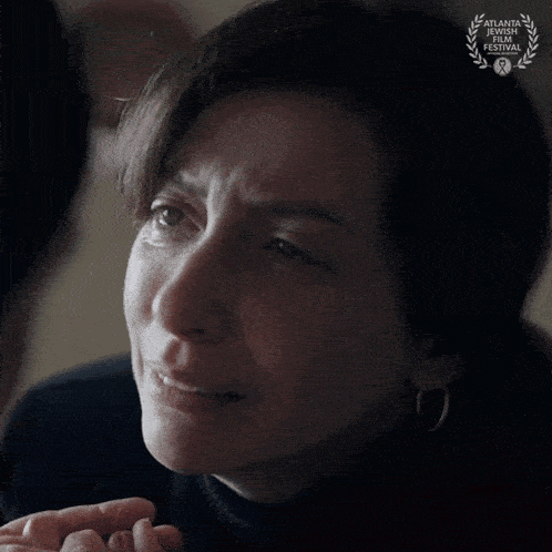 a close up of a woman 's face with a laurel wreath that says atlanta international film festival on it