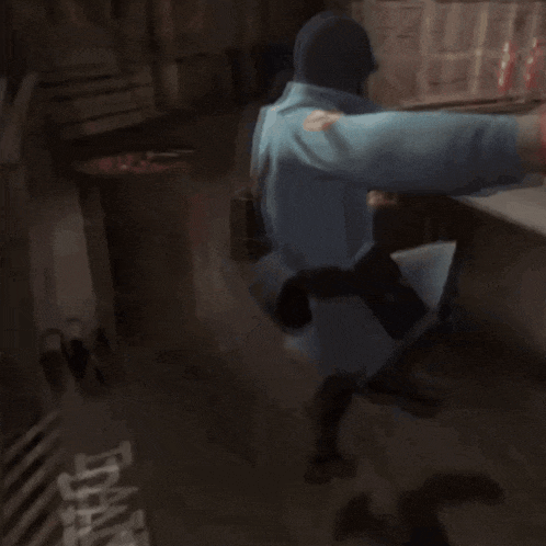 a man in a blue coat is holding a gun