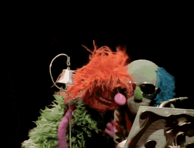 a clown playing a saxophone next to a microphone