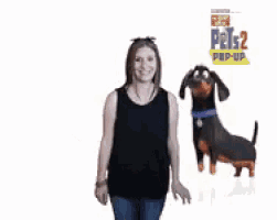 a woman standing next to a stuffed dog with pets 2 pop up on the bottom