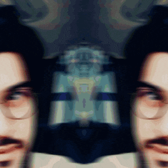 a close up of a man 's face with glasses on
