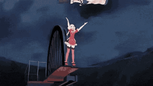 a girl in a red dress is standing on a bridge with her arms outstretched while a man is falling down .