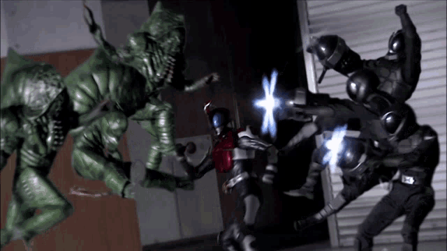 a group of soldiers are fighting a green monster in a dark room