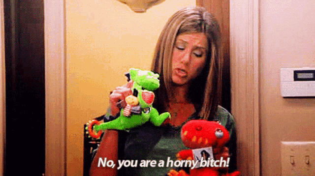 a woman is holding two stuffed animals and says `` no , you are a horny bitch '' .