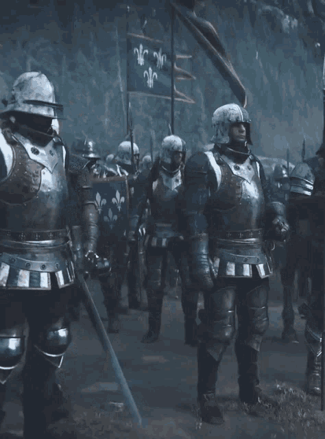 a group of men in armor holding swords and shields with a flag that says nc on it