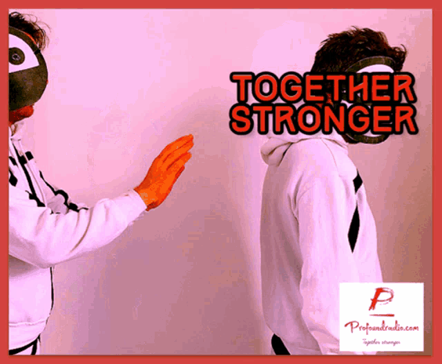 a couple of people standing next to each other with a sign that says together stronger