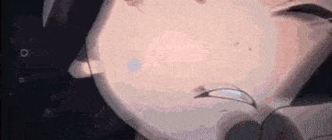a close up of a person 's face with a ring on it