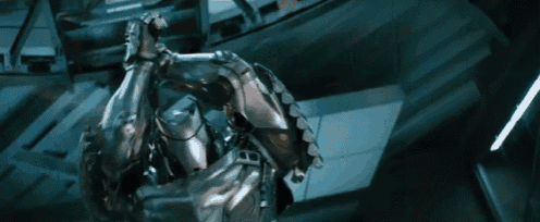 a close up of a robot 's arm in a dark room .