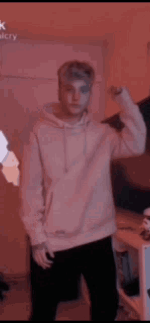 a blurry picture of a man dancing in a kitchen