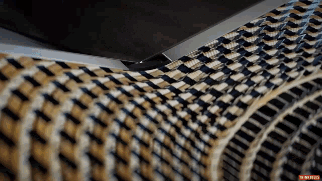 a close up of a wicker couch with the words thinkjunkie on the bottom right