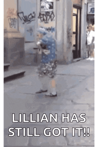 a person is walking down a street with the words " lillian has still got it " on the bottom