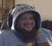 a close up of a person wearing a hoodie and headphones .