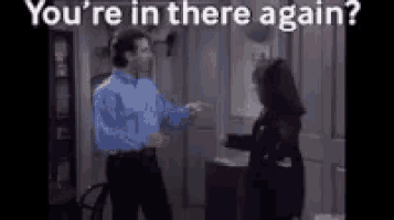 a man and a woman are dancing in a room with the words `` you 're in there again '' .